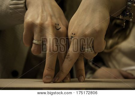 Two hands of lovers cringe at their wedding