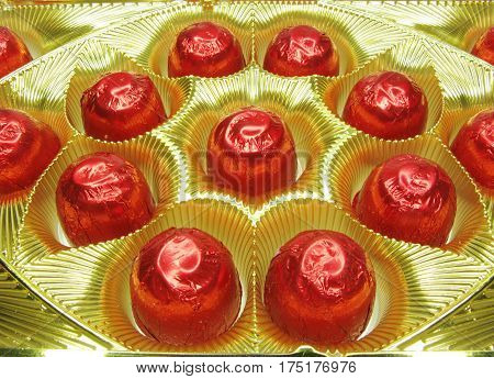 sweetmeats in red casing in gold box