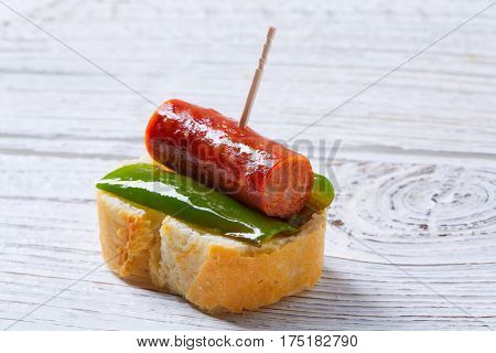 pinchos pintxos chistorra with pepper tapas from Spain sausage food