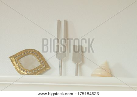 tuning fork and crystal on table .