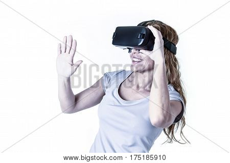 attractive happy and excited woman using 3d goggles watching 360 virtual reality vision enjoying cyber fun experience in vr simulation reality and new video gaming technology isolated background