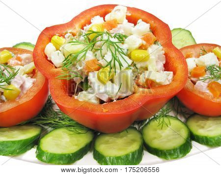 stuffed red pepper and tomato with parsley and fennel on the plate