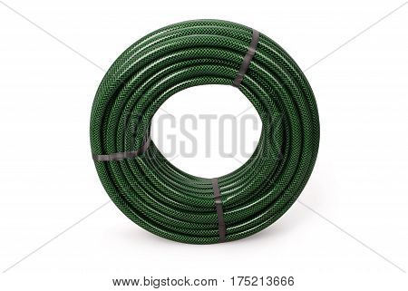 Green garden water hose rolled up in a tangle isolated on white background with soft shadow. Photo with clipping path