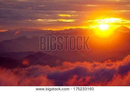 Gosaikunda area Orange sunset above mountain in valley Himalayas mountains