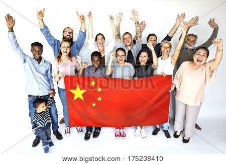 Group of people holding chinese flag studio portrait