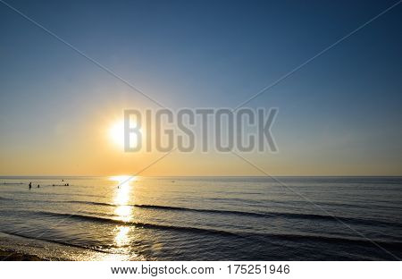 Sea Sunset. People Bathe In The Evening At Sunset In The Sea.