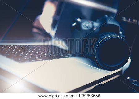 Microstock Photo Business Concept Photo with DSLR Camera and Modern Laptop Workstation For Photography Editing.