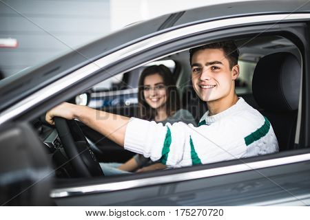 Young Couple With Keys To New Car