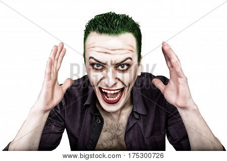 guy with crazy joker face, green hair and idiotic smike. carnaval costume.