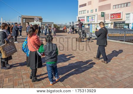 Tokyo, Japan - 17 February 2017: Some people performing in front of Aqua city building in Odaiba Tokyo