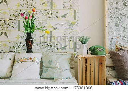 vase with tulips and in spring backgroud.interiror