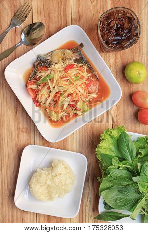 Top view Papaya salad of somtum in Thai food style for design diet background.