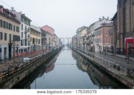 Naviglio Grande canal in the foggy morning Milan Italy