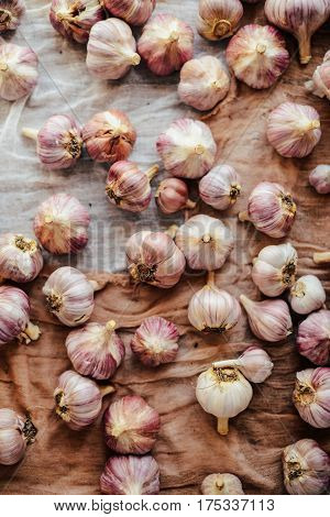 Close-up Garlic Bulbs And Garlic Cloves On Wodeen Background. Ga