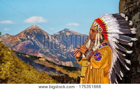 Peruvian Indian in a national costume plays on a pipe in the mountains