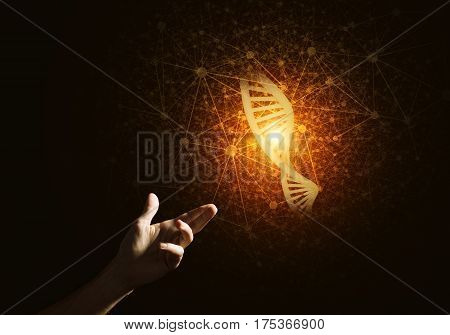 Close of man hand presenting DNA molecule research as concept. Mixed media