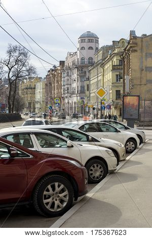 Kronverskiy Avenue St. Petersburg the cars parked along the road buildings Sunny day architecture Russia tree spring road signs