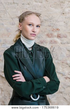 MILAN ITALY - FEBRUARY 25: Gorgeous model wears her own cloths and poses in the backstage just before Cividini show during Milan Women's Fashion Week on FEBRUARY 25 2017 in Milan.