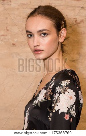 MILAN ITALY - FEBRUARY 25: Gorgeous model poses in the backstage just before Cividini show during Milan Women's Fashion Week on FEBRUARY 25 2017 in Milan.