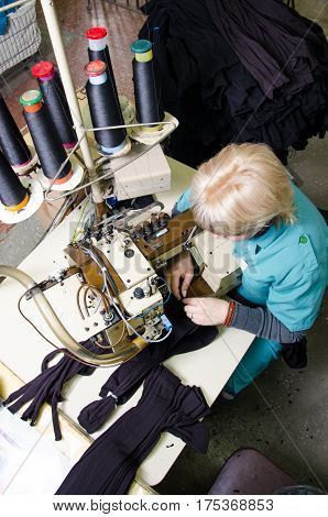 Worker in textile fabric. Hoisery factory. Socks production