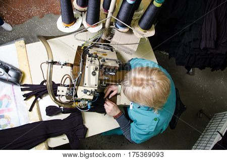Worker in textile fabric. Hoisery factory. Socks production