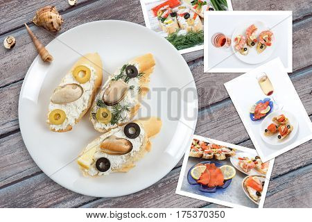 Beautiful snapshots of various italian sandwiches with seafood arranged on rustic wooden background with plates with food and seashells with copy space horizontal top view.