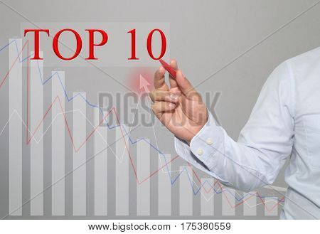 Hand of businessman write a text of TOP 10 in concept of presenting ideas in your business.