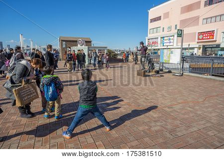 Tokyo, Japan - 17 February 2017: Some people performing in front of Aqua city building in Odaiba Tokyo