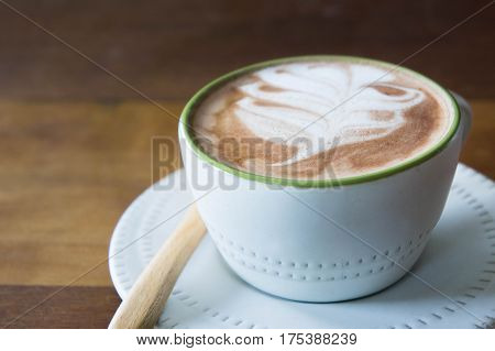 coffee cup and delicious cake strawberry and relax time moblie on table in coffee shop