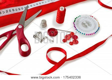 Sewing tools - scissors, buttons, sewing pins, sewing needle, safety pins, thread and fabric