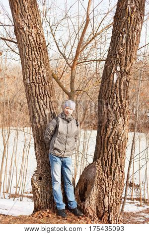 The Man In Spring Clothes Costs At A Tree