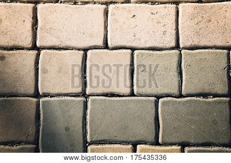 Seamless tileable texture pavement brick paving stones on a sidewalk