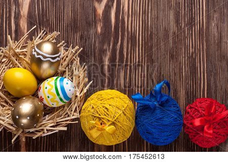 Colorful easter edds on a brown wooden table