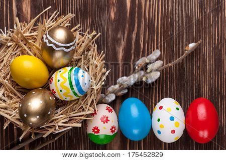 Colorful easter edds on a brown wooden table