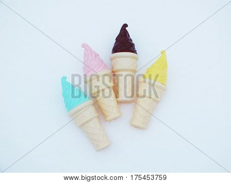 Toy ice cream on snow white background