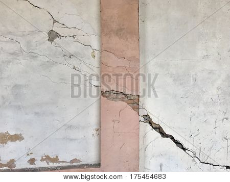 cracked painted plaster exposed crumble brick wall derelict grunge background