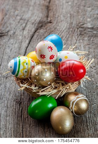 Colorful easter edds on a old wooden table