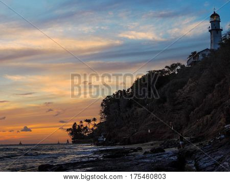 sunset at the diamondhead lighthouse from the beach