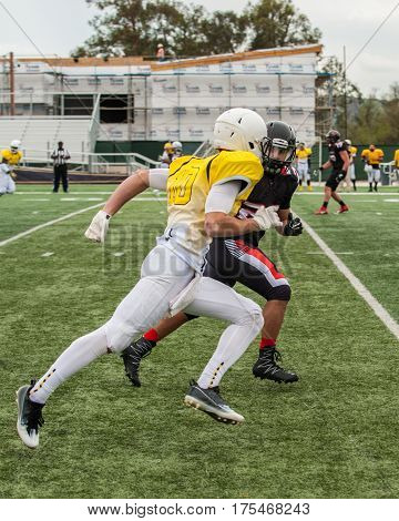 Football cornerback playing man to man coverage on wide receiver.