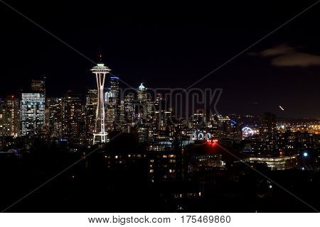 SEATTLE, WASHINGTON, USA - JAN 23rd, 2017: Night Cityscape of Seattle Skyline with Dark Sky Background for Building Lights, panorama seen from Kerry Park, Space Needle in focus.