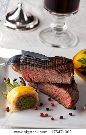 steak with grilled potato on a plate