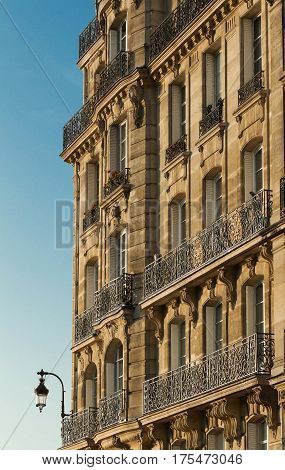 Traditional French Architecture with Typical Windows and Balconies in Paris, France. Haussmann's renovation of Paris Houses.