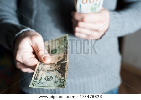 Man Giving Us Dollar Banknote And Holding Cash In Hands.