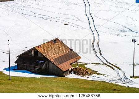 Natural Landscape With Lonely House In The Snow. Alps.