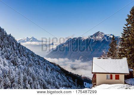 Natural Landscape With Lonely House In The Snow. Alps.