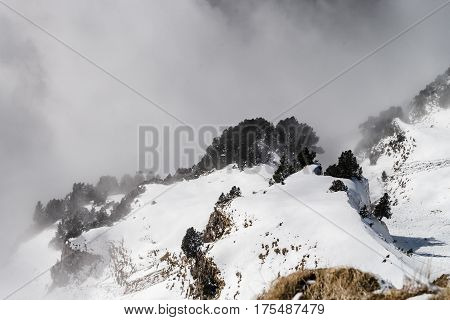 Beautiful Mountains In Snow. Evening Aerial View With Shadows.