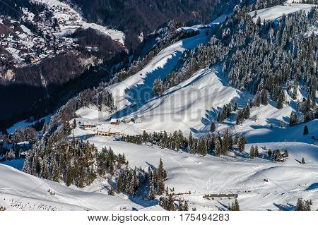 Beautiful Mountains In Snow. Evening Aerial View With Shadows.
