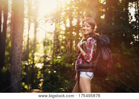 Female backpacker set out on forest hike advanture