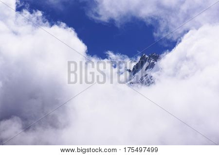 The mountain in the clouds sunny day