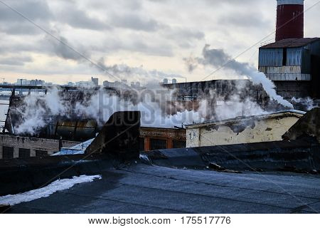 the thick smoke belching from factory chimneys